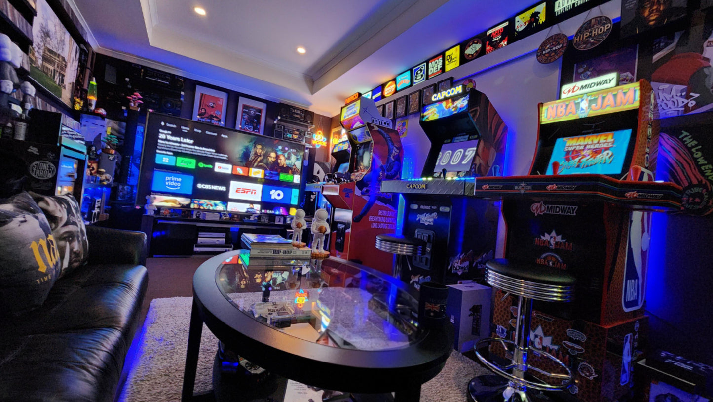 Game room with arcade machines and gaming setup